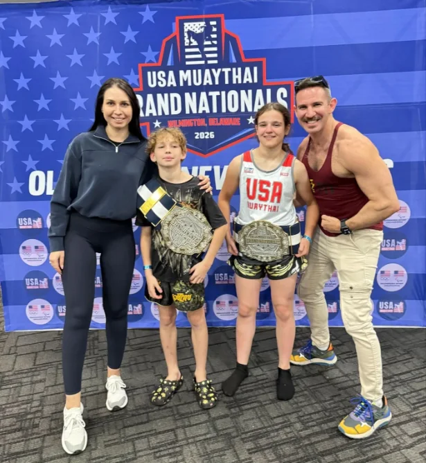 Demi Bendet and Amil Yagubov holding championship belts